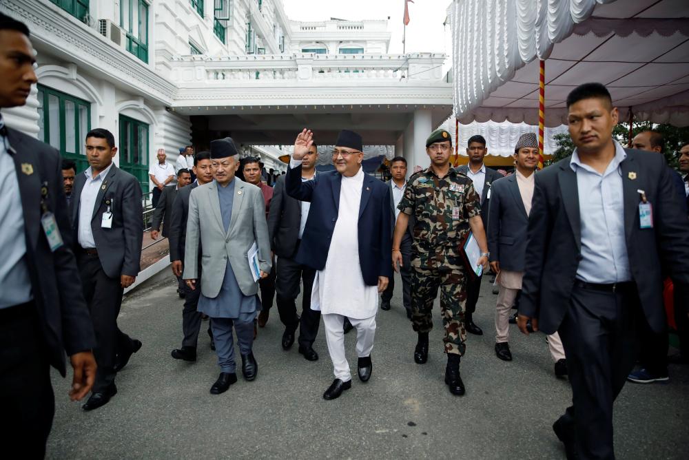Nepal`s Prime Minister Khadga Prasad Sharma Oli, also known as K.P. Oli, smiles as he walks out after the inauguration of the Motihari-Amlekhganj petroleum pipeline project at Singha Durbar, in Kathmandu, Nepal, September 10, 2019. REUTERS