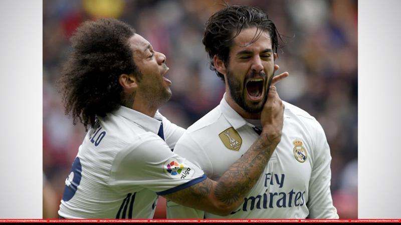 Real Madrid left back Marcelo with midfielder Isco. REUTERS