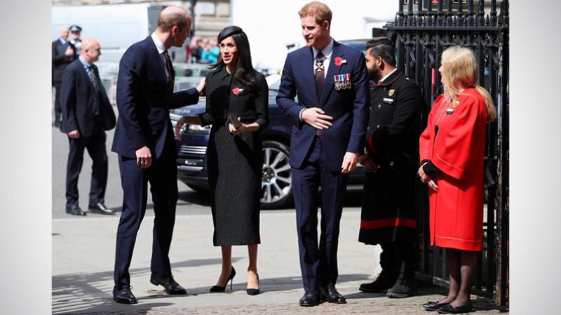 Britain`s Prince William greets his brother Harry`s fiancee Meghan Markle as they arrive for an ANZAC day service at Westminster Abbey in London, April 25, 2018. REUTERS