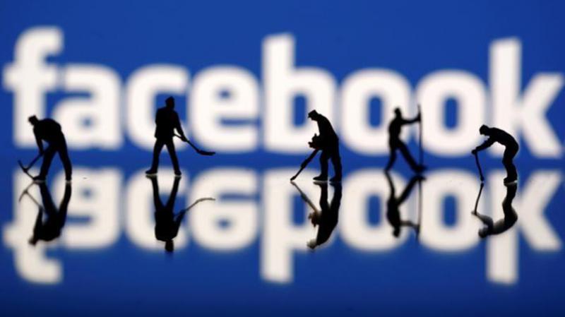 Figurines are seen in front of the Facebook logo in this illustration taken March 20, 2018. (Photo Reuters)