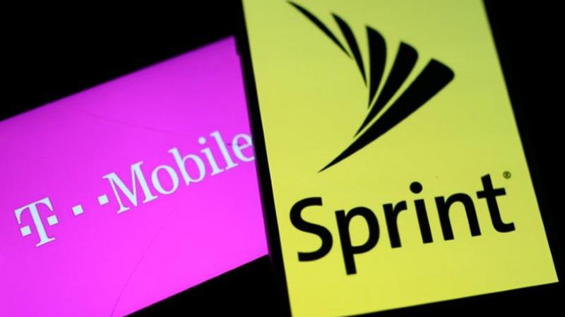 Smartphones with the logos of T-Mobile and Sprint are seen in this illustration taken September 19, 2017. REUTERS