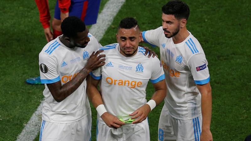 Marseille`s Dimitri Payet is consoled by Andre-Frank Zambo Anguissa and Morgan Sanson as he leaves the pitch in tears after sustaining an injury in Olympique de Marseille vs Atletico Madrid match on May 16, 2018. REUTERS
