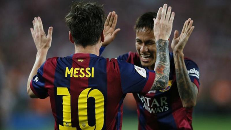 Lionel Messi celebrates with Neymar after scoring the first goal for Barcelona during the Spanish King`s Cup Final between Athletic Bilbao and FC Barcelona at Nou Camp, Barcelona, Spain on May 30, 2015. REUTERS.