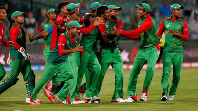 Bangladesh players celebrate their win over England, knocking them out of the Cricket World Cup tournament in Adelaide, March 9, 2015. REUTERS