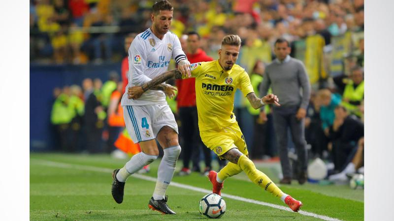 Real Madrid`s Sergio Ramos in action with Villarreal`s Samu Castillejo on May 19, 2018. REUTERS