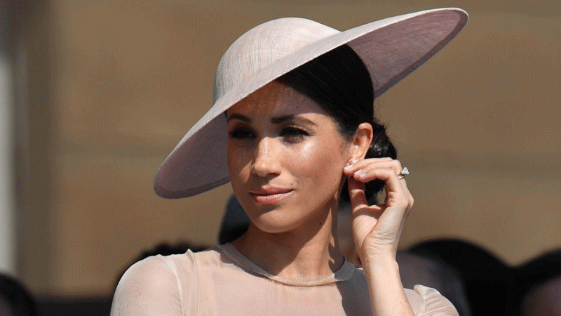 Meghan, Duchess of Sussex attends a garden party at Buckingham Palace, in London, Britain May 22, 2018. REUTERS