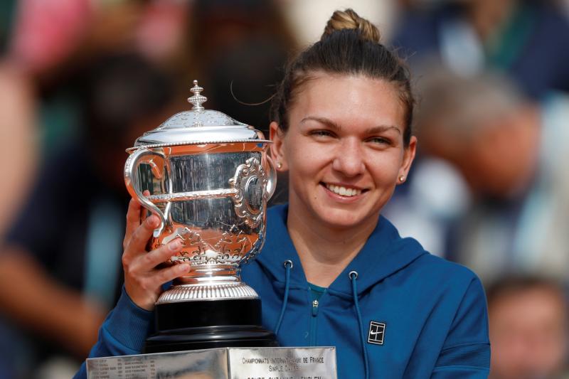 Romania’s Simona Halep celebrates by kissing the trophy after winning the final against Sloane Stephens of the US in  French Open final at Roland Garros, Paris, on June 9, 2018. REUTERS