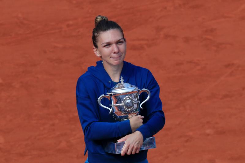 Romania’s Simona Halep celebrates by kissing the trophy after winning the final against Sloane Stephens of the US in  French Open final at Roland Garros, Paris, on June 9, 2018. REUTERS