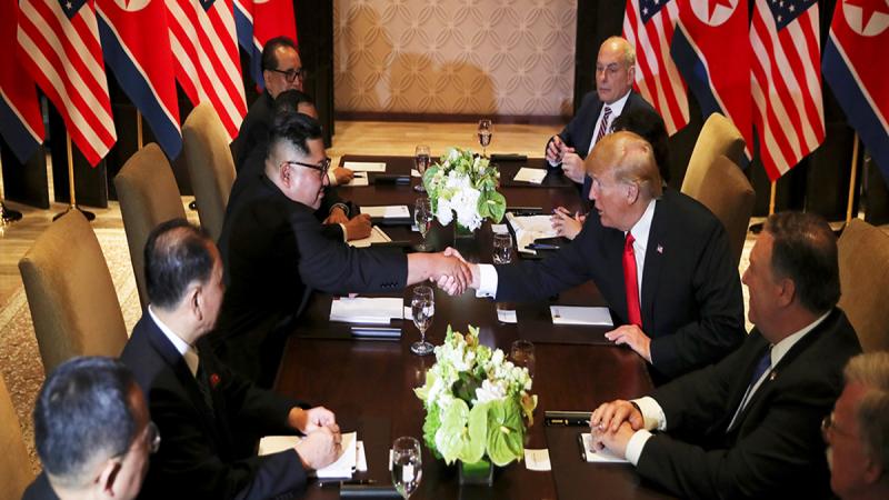 US President Donald Trump shakes hands with North Korea`s leader Kim Jong Un before their bilateral meeting at the Capella Hotel on Sentosa island in Singapore June 12, 2018. REUTERS