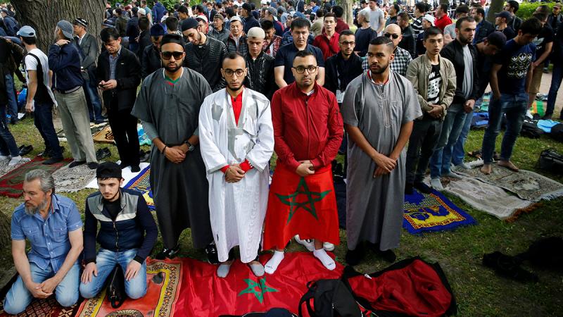 Supporters of the Moroccan national soccer team attend an Eid al-Fitr mass prayer to mark the end of the holy fasting month of Ramadan in Saint Petersburg, Russia June 15, 2018. REUTERS