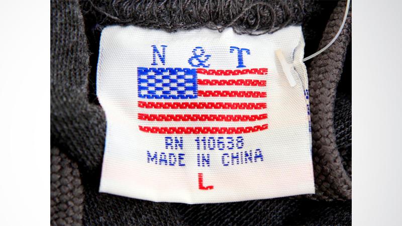 The label of a Washington D.C. sweatshirt bears a U.S. flag but says `Made in China` at a souvenir stand in Washington, DC, U.S., January 14, 2011. REUTERS