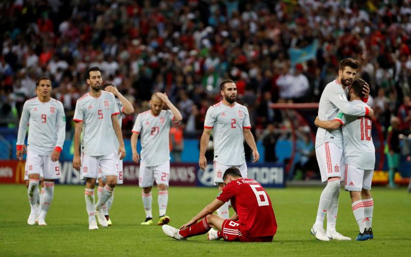 Spain`s Gerard Pique and Jordi Alba celebrate victory as Iran`s Saeid Ezatolahi looks dejected after a Group B match at Kazan Arena, Kazan, Russia on June 20, 2018  REUTERS