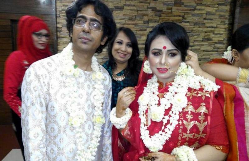 This photo obtained from social media shows Bappa Mazumder and Tania Hossain at their wedding reception.