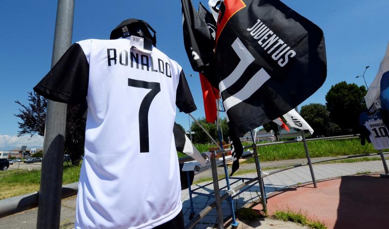 A Juventus` jersey with the name of Cristiano Ronaldo is exhibited in a shop in Turin, Italy July 7, 2018. REUTERS