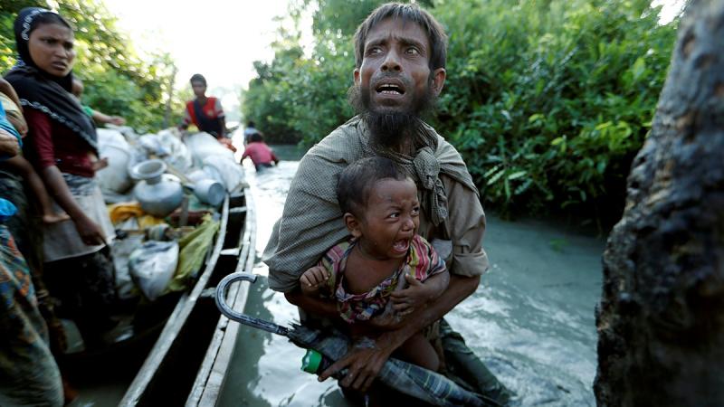 This October 2017 photo shows Rohingyas arriving at the Bangladeshi side of the Naf River after crossing the border from Myanmar, in Palang Khali, Bangladesh. REUTERS