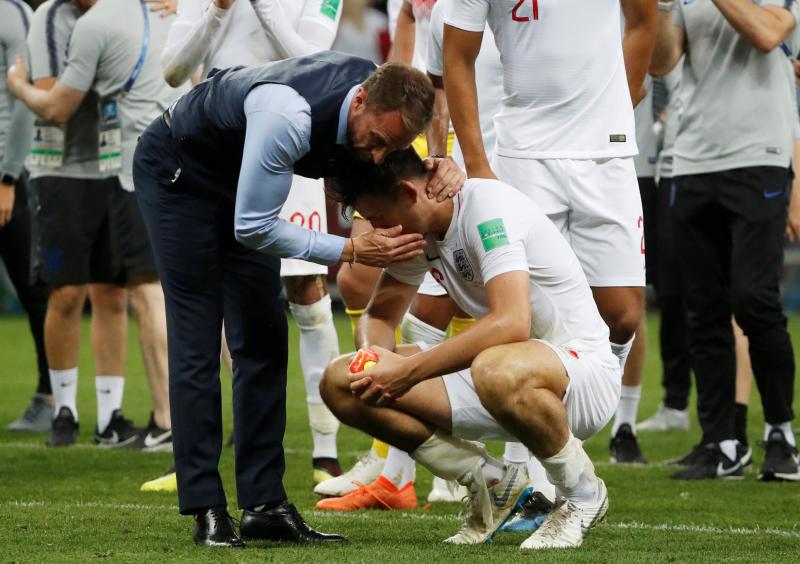 World Cup - Semi Final - Croatia v England - Luzhniki Stadium, Moscow, Russia - July 11, 2018  England manager Gareth Southgate consoles Harry Maguire after the match   REUTERS