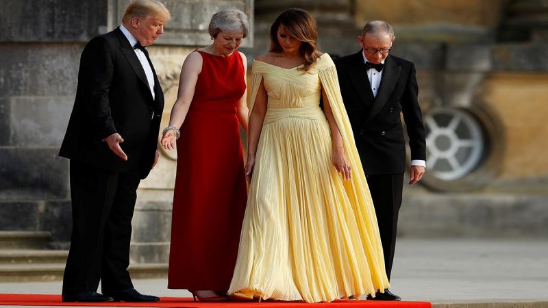 British Prime Minister Theresa May and her husband Philip stand together with US President Donald Trump and First Lady Melania Trump at the entrance to Blenheim Palace, where they are attending a dinner with specially invited guests and business leaders, near Oxford, Britain, Jul 12, 2018. REUTERS