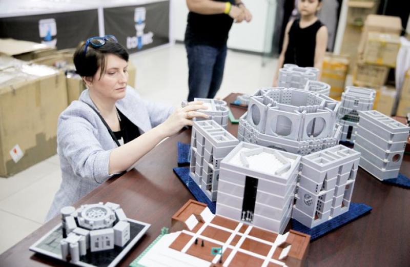 Juditha assembles the national assembly building with LEGO bricks at ToyCon 2018 on Friday Dhaka Tribune