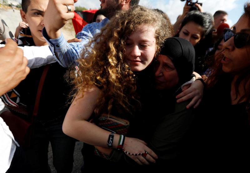 Palestinian teenager Ahed Tamimi is welcomed by relatives and supporters after she was released from an Israeli prison, at Nabi Saleh village in the occupied West Bank July 29, 2018. REUTERS