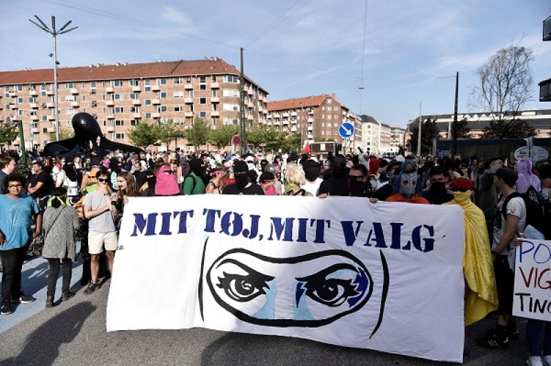 Demonstration on the first day of the implementation of the Danish face veil ban in Copenhagen, Denmark August 1, 2018. The poster reads `My clothes my, choice`. REUTERS
