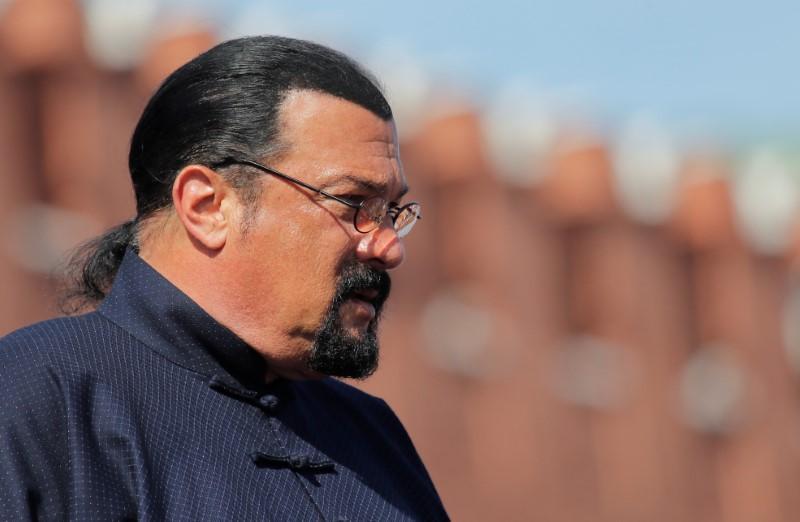 U.S. actor Steven Seagal watches the Victory Day parade, marking the 73rd anniversary of the victory over Nazi Germany in World War Two, at Red Square in Moscow, Russia May 9, 2018. REUTERS/FILE PHOTO