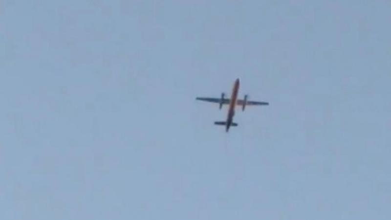 A Horizon Air Bombardier Dash 8 Q400, reported to be hijacked, flies over Fircrest, Washington, the U.S., before crashing in the South Puget Sound, August 10, 2018 in this still image taken from a video obtained from social media. Leah Morse/via REUTERS
