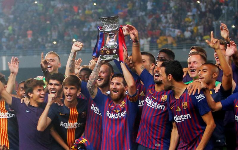 Barcelona`s Lionel Messi lifts the trophy as he celebrates winning the Spanish Super Cup with team mates at Grand Stade de Tanger, Tangier, Morocco on August 12, 2018. REUTERS