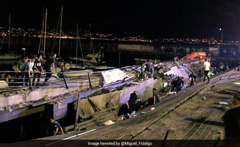 Hundreds hurt as Spanish festival boardwalk collapses into sea.