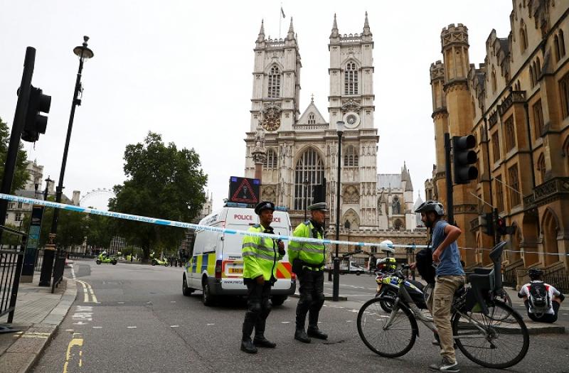 Police officers stand at a cordon after a car crashed outside the Houses of Parliament in Westminster, London, Britain, August 14, 2018. REUTERS
