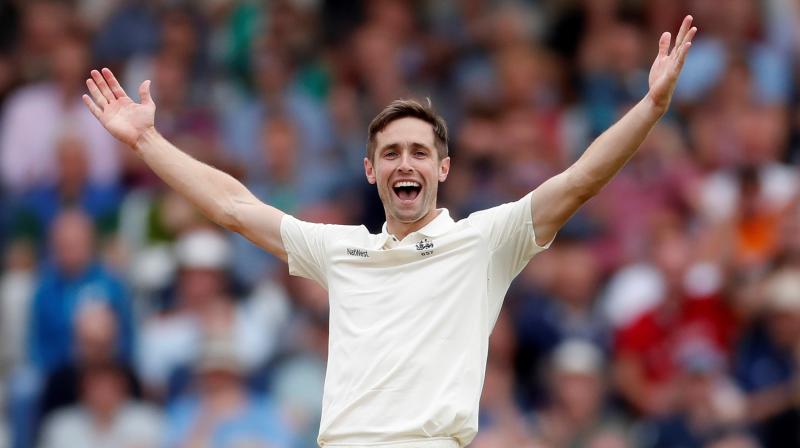 England`s Chris Woakes celebrates after taking the wicket of India`s Cheteshwar Pujara on the opening day of the Third Test against India in Trent Bridge, Nottingham on August 18, 2018. Reuters