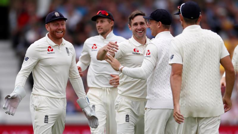 England`s Chris Woakes celebrates with team mates after taking the wicket of India`s Lokesh Rahul on the opening day of the Third Test against India in Trent Bridge, Nottingham on August 18, 2018. Reuters