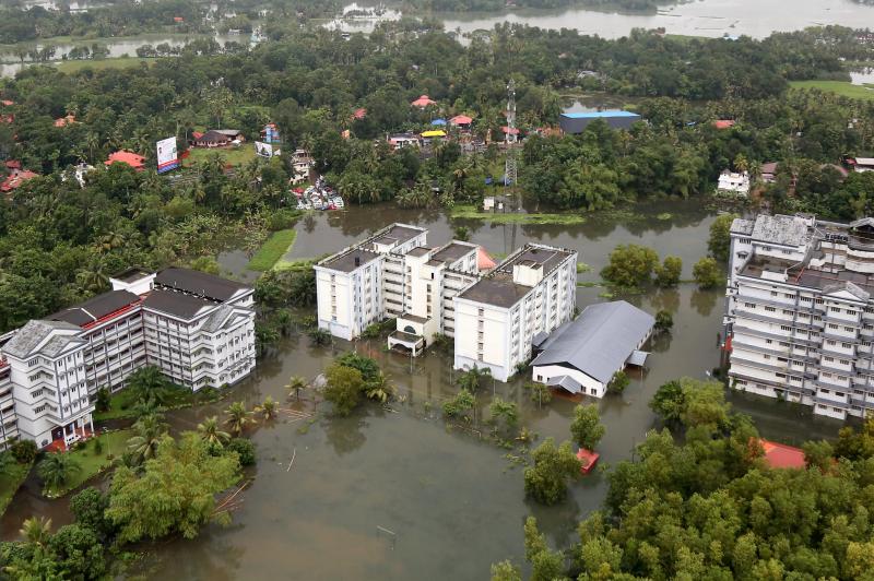 An aerial view shows partially submerged buildings at a flooded area in the southern state of Kerala, India, August 19, 2018. REUTERS