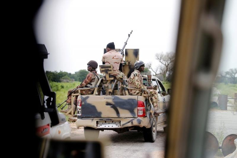 A Nigerian army convoy vehicle drives ahead with an anti-aircraft gun, on its way to Bama, Borno State, Nigeria August 31, 2016. REUTERS