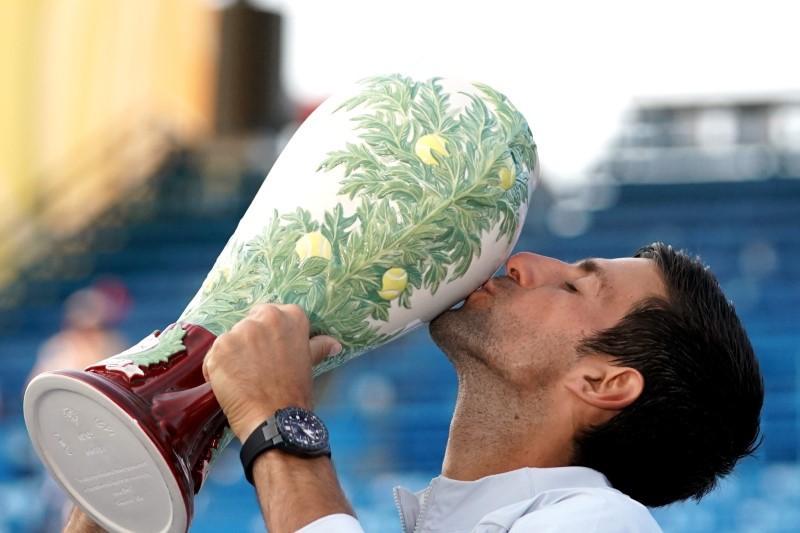 Novak Djokovic poses for photos while holding the Rookwood Cup after defeating Roger Federer during the finals in the Western and Southern tennis open at Lindner Family Tennis Center on Aug 19, 2018 at Mason, OH, USA. Aaron Doster-USA TODAY Sports