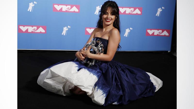 2018 MTV Video Music Awards - Photo Room - Radio City Music Hall, New York, U.S., August 20, 2018. - Camila Cabello poses backstage with her awards for Artist of the Year and Video of the Year for `Havana.` REUTERS