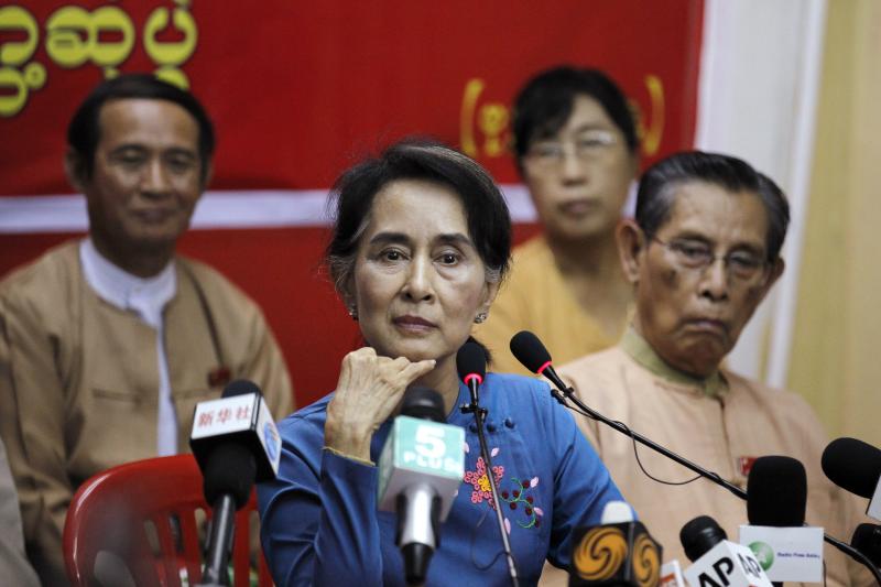 Myanmar`s pro-democracy leader Aung San Suu Kyi listens as reporter asks her a question during a news conference at the National League for Democracy party head office in Rangoon on Nov. 5, 2014. Reuters