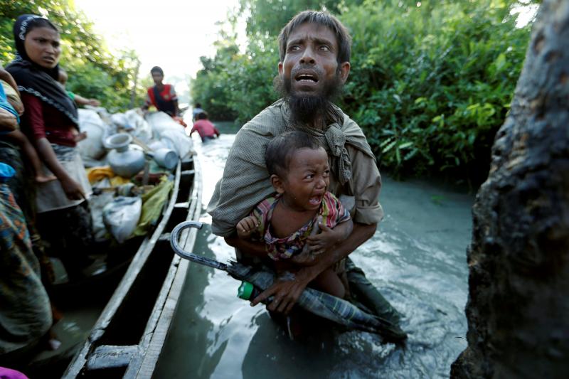 Rohingya refugees arrive to the Bangladeshi side of the Naf River after crossing the border from Myanmar, in Palang Khali, Bangladesh, October 16, 2017. REUTERS