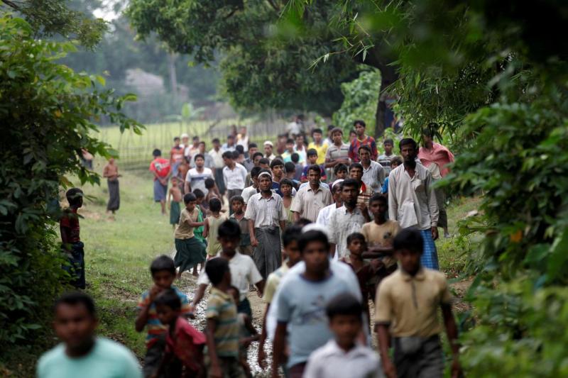 Men walk at a Rohingya village outside Maugndaw in Rakhine state, Myanmar October 27, 2016. REUTERS/FILE PHOTO