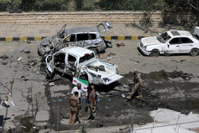 Free Syrian Army members (FSA) inspect damaged cars after a car bomb in Azaz, Syria September 1, 2018. REUTERS