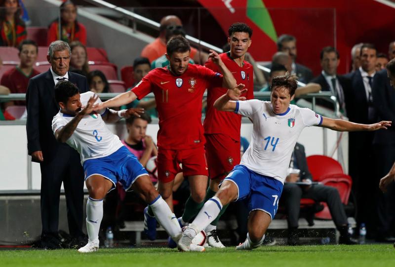 Portugal`s Bernardo Silva in action with Italy`s Emerson Palmieri and Federico Chiesa at Estadio da Luz, Lisbon, Portugal on Sept 10, 2018. REUTERS
