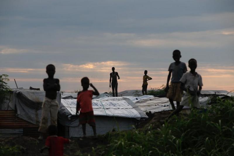 Internally displaced people (IDPs) stand on roofs in the Protection of Civilians (POC) Camp, run by the UN Mission in South Sudan near the town of Malakal, in the Upper Nile state of South Sudan, September 8, 2018. REUTERS