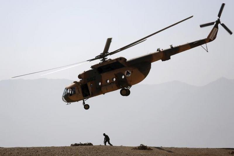 An Afghan National Army (ANA) helicopter flies over a soldier during a training exercise at the Kabul Military Training Centre in Afghanistan October 7, 2015. REUTERS/FILE PHOTO