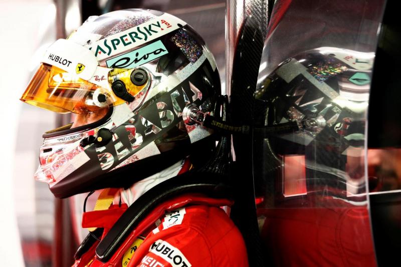 Ferrari`s Sebastian Vettel looks on in the garage during the qualifying session of the Singapore Grand Prix September 15, 2018. REUTERS