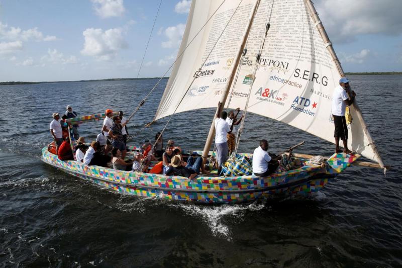 People take part in the first voyage sail of Flipflopi, the first dhow boat made entirely of recycled plastic, after the launch ceremony on the island of Lamu, Kenya, September 15, 2018. REUTERS