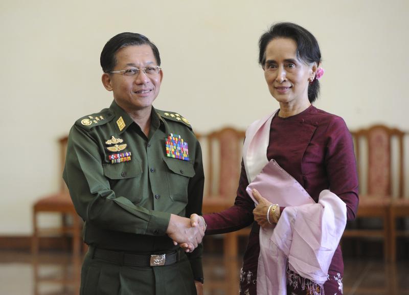Myanmar’s Commander in Chief Min Aung Hlaing and State Counsellor Aung San Suu Kyi in Naypyidaw, Burma, on Dec. 2, 2015. REUTERS