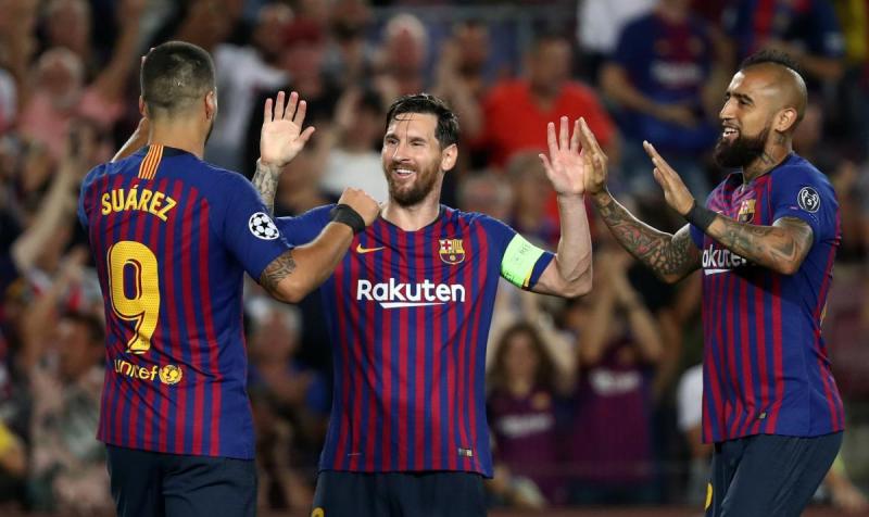 Barcelona's Lionel Messi celebrates with Luis Suarez and Arturo Vidal after scoring their fourth goal to complete his hat-trick against PSV Eindhoven at Camp Nou, Barcelona, Spain on Sept 18, 2018. REUTERS
