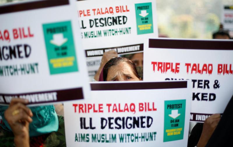 Muslim women hold placards during a protest against a bill passed by India`s lower house of Parliament last week that aims at prosecuting Muslim men who divorce their wives through the `triple talaq,` or instant divorce, in New Delhi, India January 4, 2018. REUTERS/FILE PHOTO