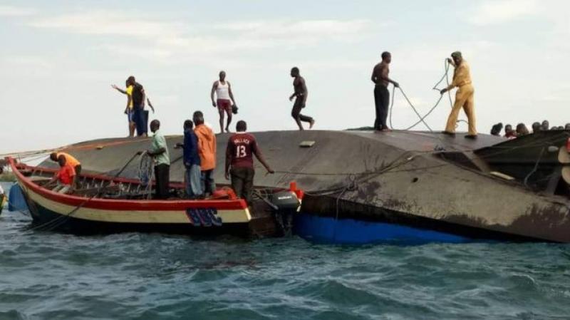 Rescue workers are seen at the scene where a ferry overturned in Lake Victoria, Tanzania on Sept 21, 2018. 