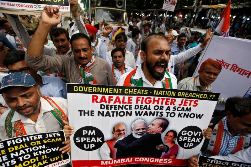 Supporters of India`s main opposition Congress Party shout slogans during a protest demanding from government to disclose the details of Rafale fighter planes deal, in Mumbai, India, July 30, 2018. REUTERS