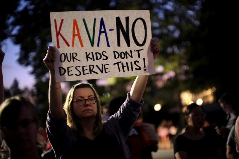 Activists gather outside the U.S. Supreme Court to hold a vigil in opposition to U.S. Supreme Court nominee Brett Kavanaugh in Washington, U.S., October 3, 2016. REUTERS